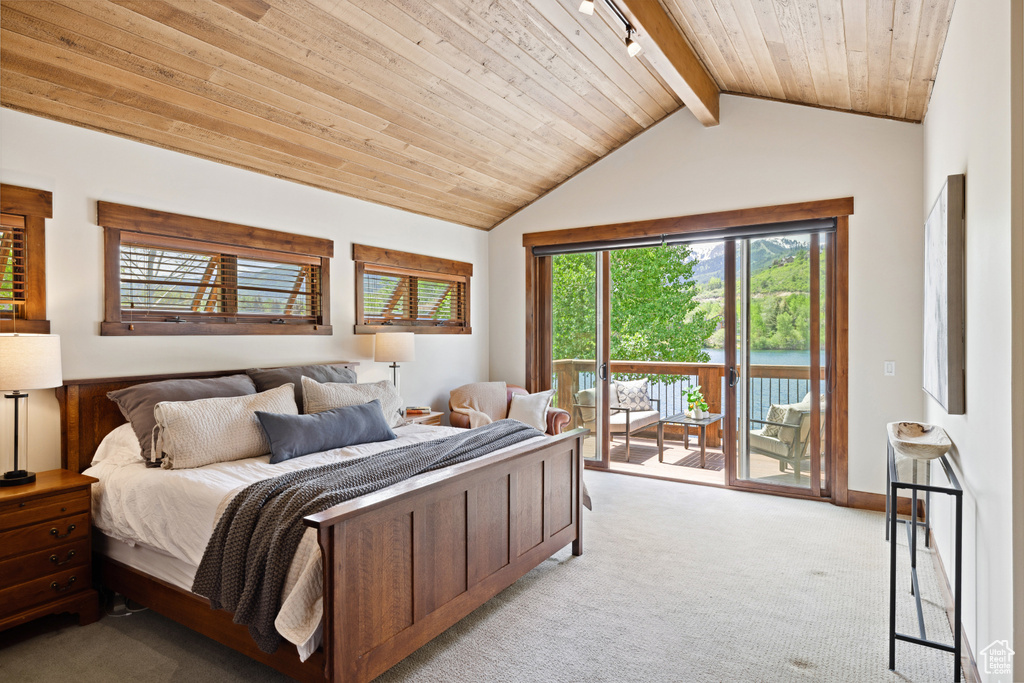 Bedroom with light colored carpet, access to exterior, and wooden ceiling