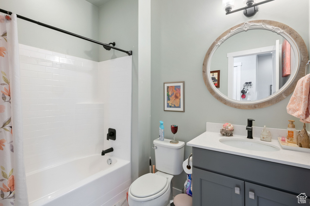 Bathroom featuring vanity and shower / tub combo