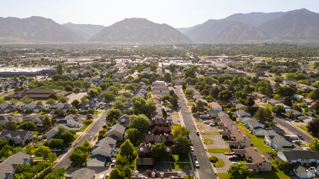 Aerial view of residential area featuring a mountainous background