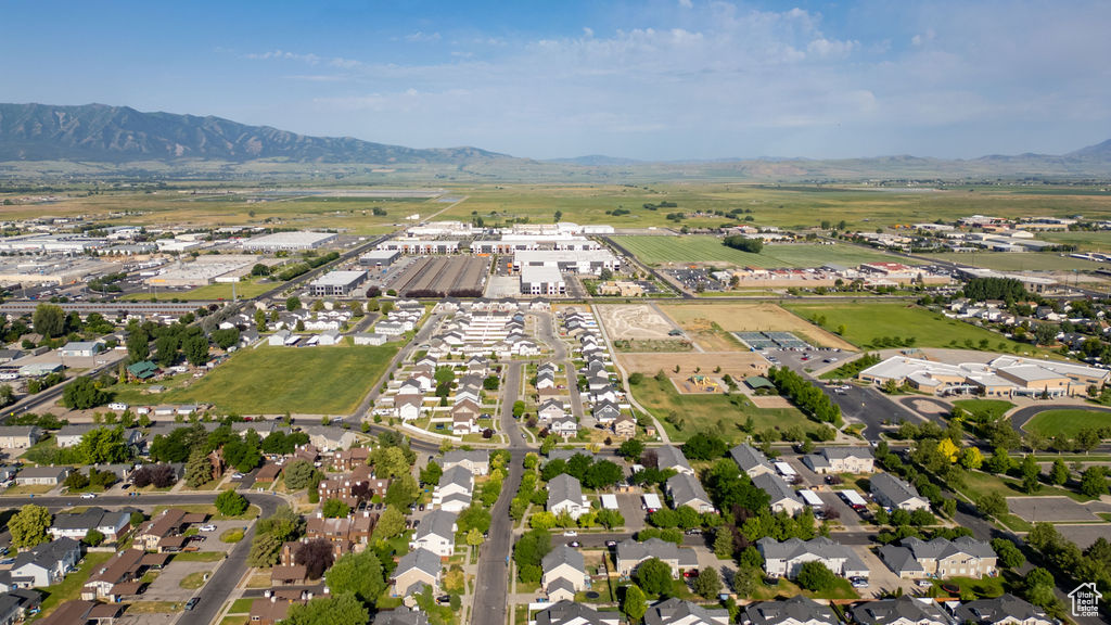 Aerial view of property and surrounding area with mountains