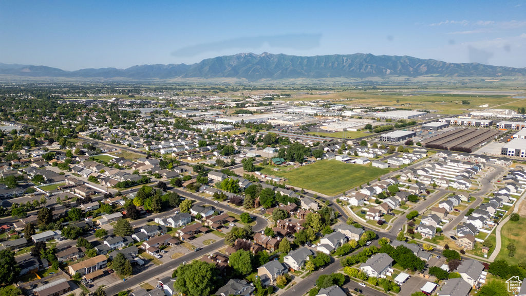 Aerial view of property's location featuring a mountain backdrop