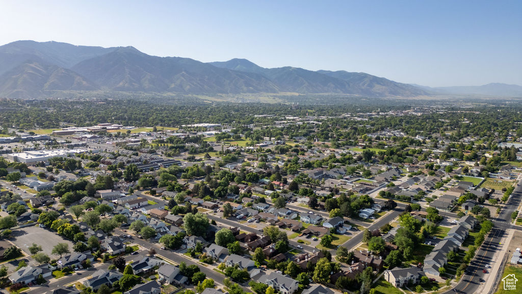 Aerial view of property's location with a mountain backdrop