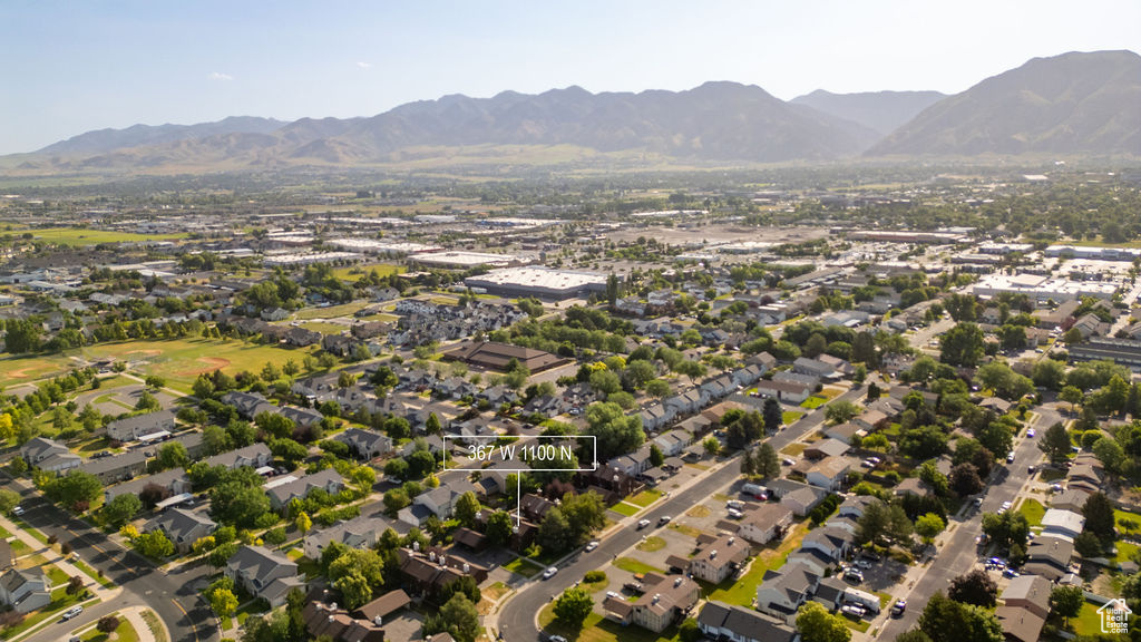 Aerial view of property's location with nearby suburban area