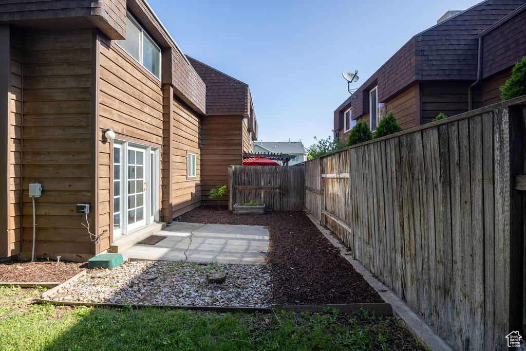 Fenced backyard featuring a patio area