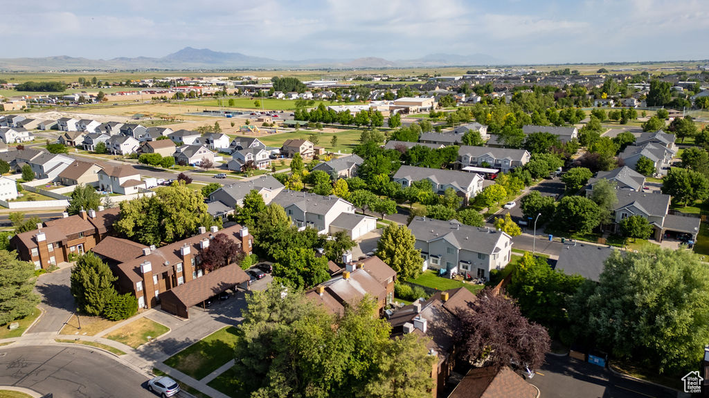 View of property location featuring nearby suburban area and a mountain backdrop