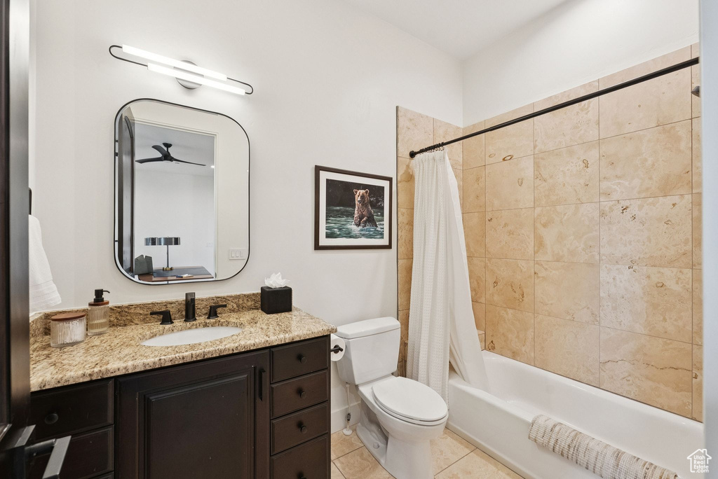 Bathroom with shower / bath combo, vanity, and tile patterned floors
