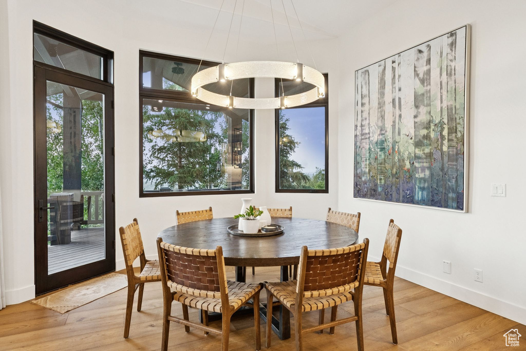 Dining area with light wood-style flooring