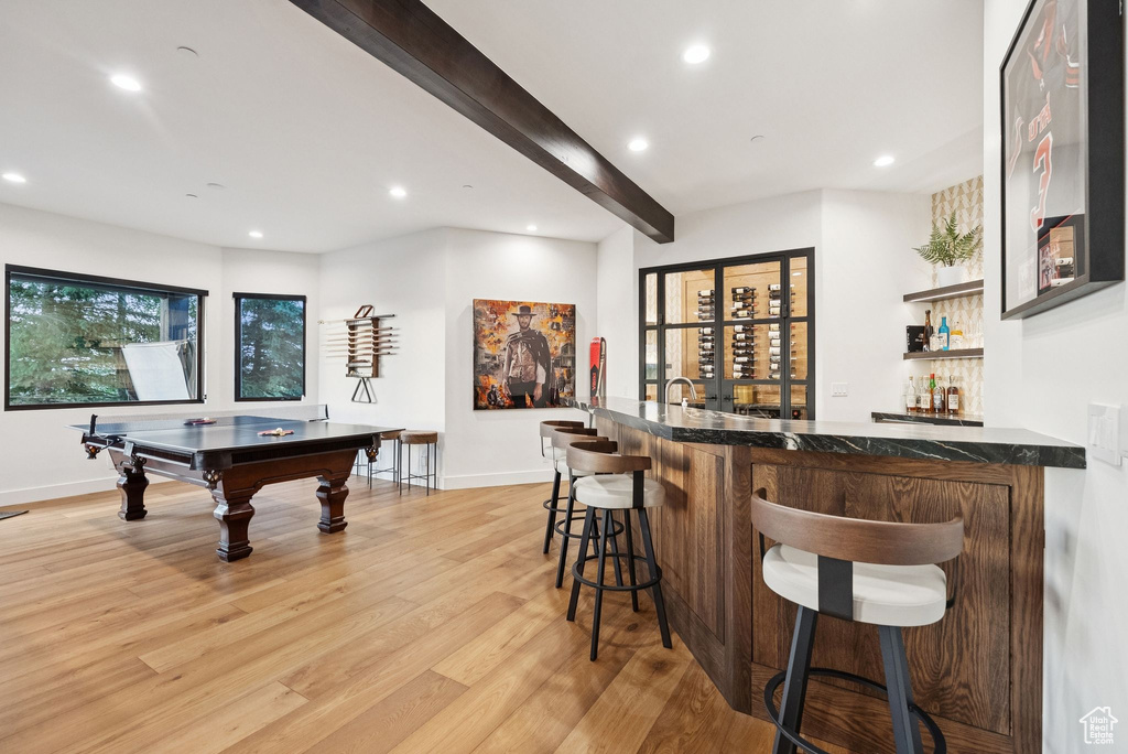 Indoor wet bar with light wood finished floors, recessed lighting, beam ceiling, and billiards