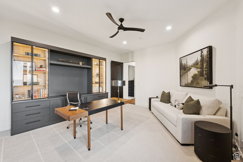 Home office with a ceiling fan and recessed lighting