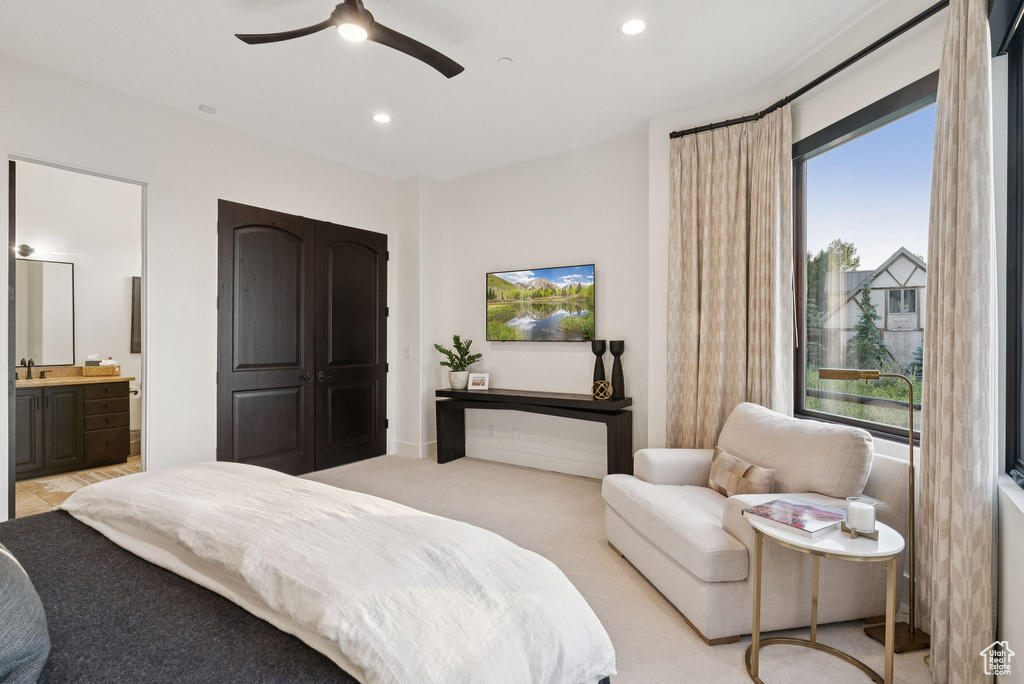 Bedroom featuring recessed lighting, connected bathroom, ceiling fan, and light colored carpet