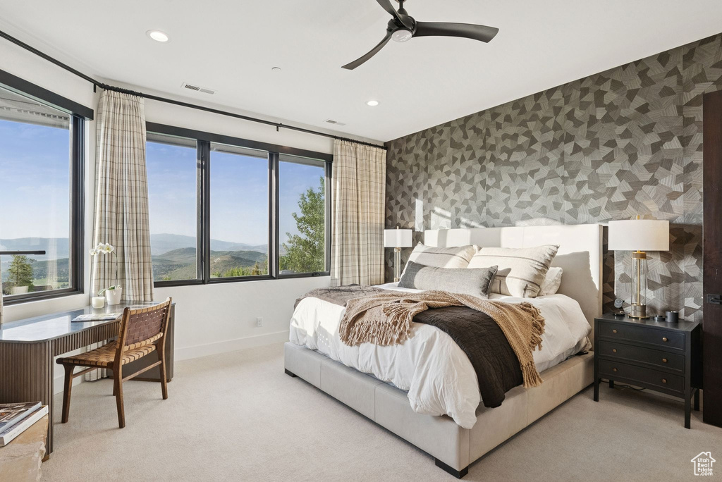 Bedroom with wallpapered walls, carpet flooring, recessed lighting, multiple windows, and ceiling fan