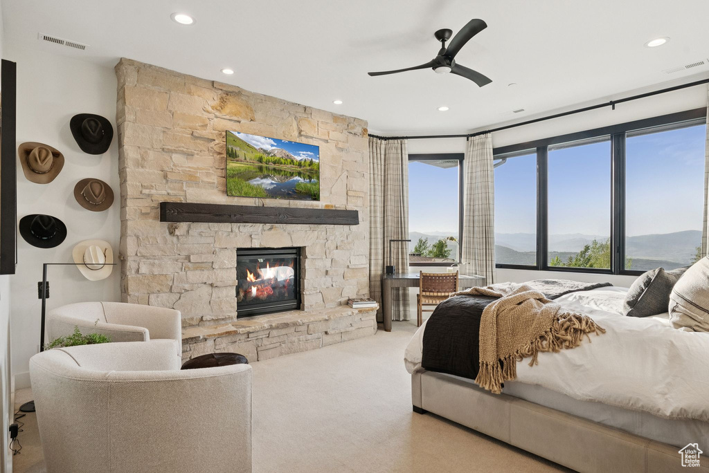 Carpeted bedroom featuring a fireplace, recessed lighting, and a ceiling fan