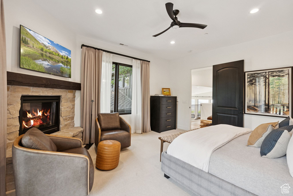 Bedroom featuring recessed lighting, a fireplace, carpet flooring, and a ceiling fan