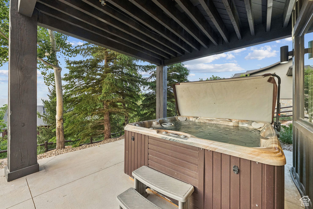 View of patio / terrace with a hot tub