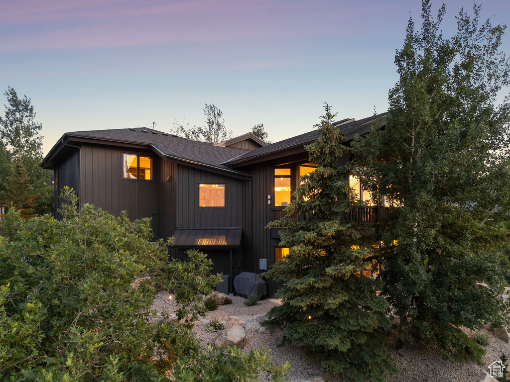 View of front of house featuring roof with shingles