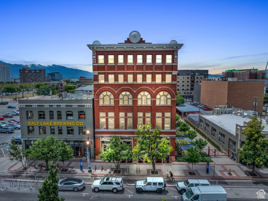 View of property with a mountain view and a city view