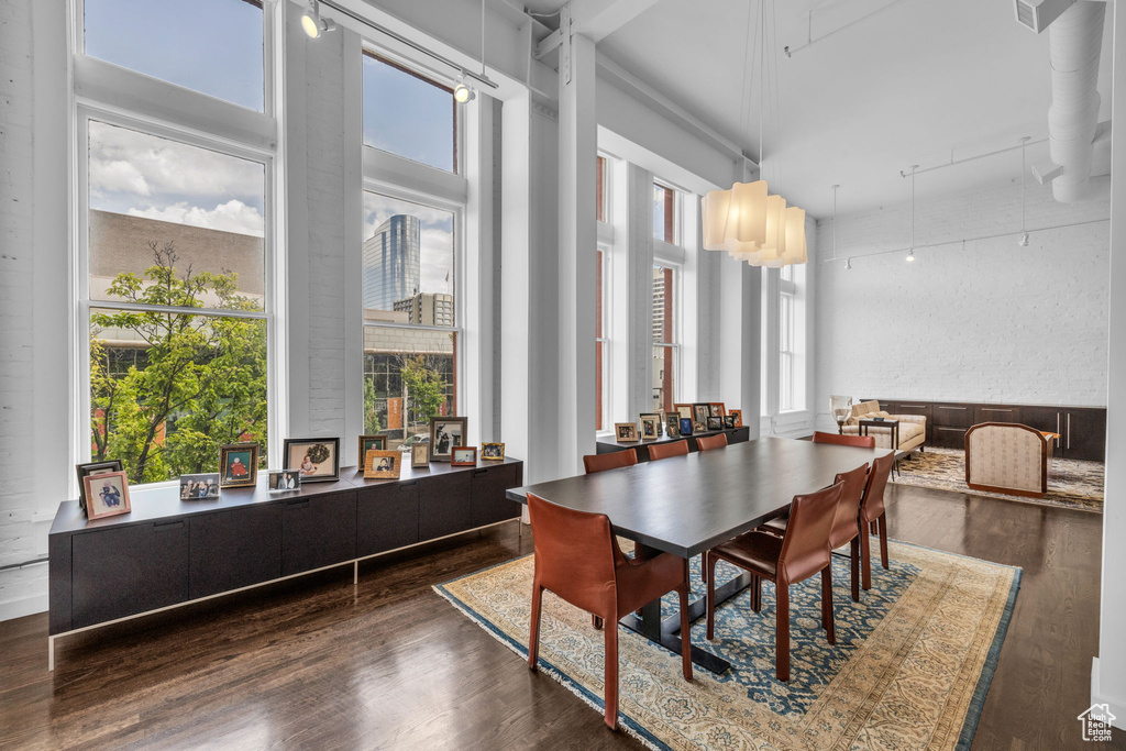 Dining area featuring wood finished floors and healthy amount of natural light