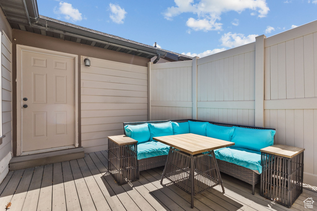 Wooden deck featuring an outdoor hangout area