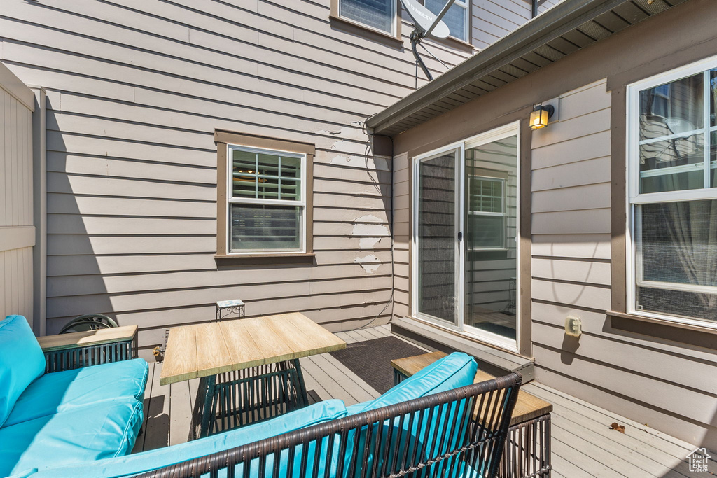 Wooden terrace with an outdoor hangout area