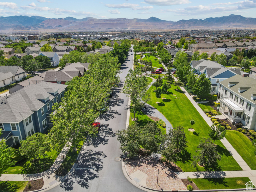 Aerial perspective of suburban area featuring a mountain backdrop