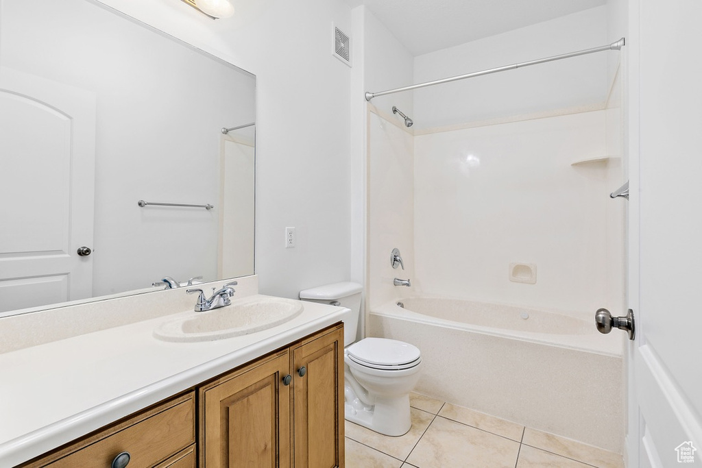 Full bathroom with vanity, tile patterned floors, and bathtub / shower combination