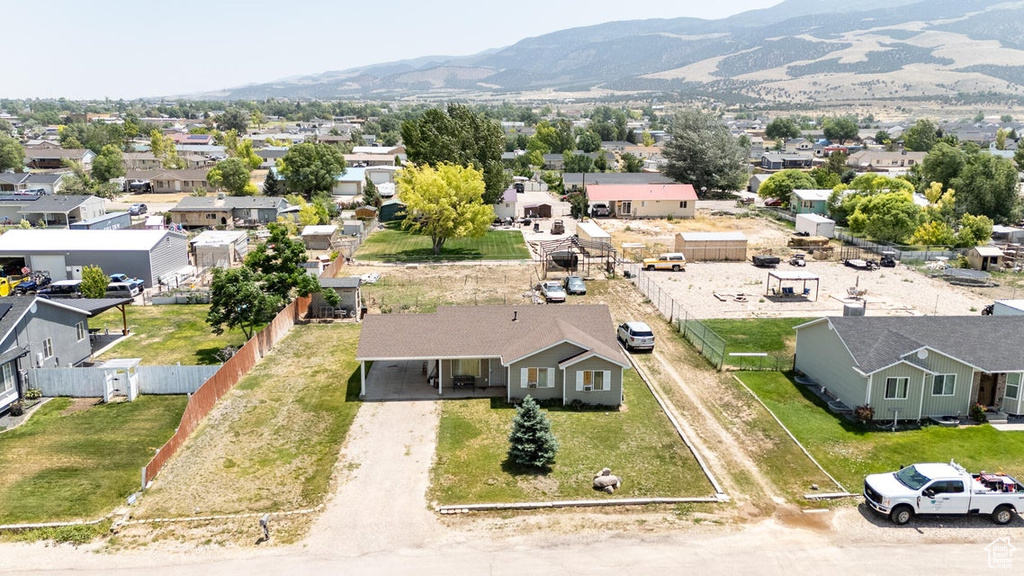 Aerial perspective of suburban area featuring a mountain backdrop