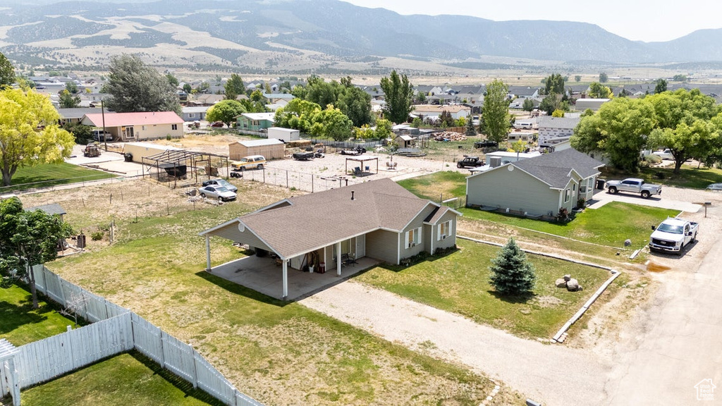 Aerial perspective of suburban area with a mountain backdrop