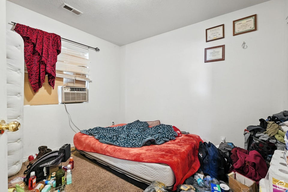 Bedroom featuring carpet flooring