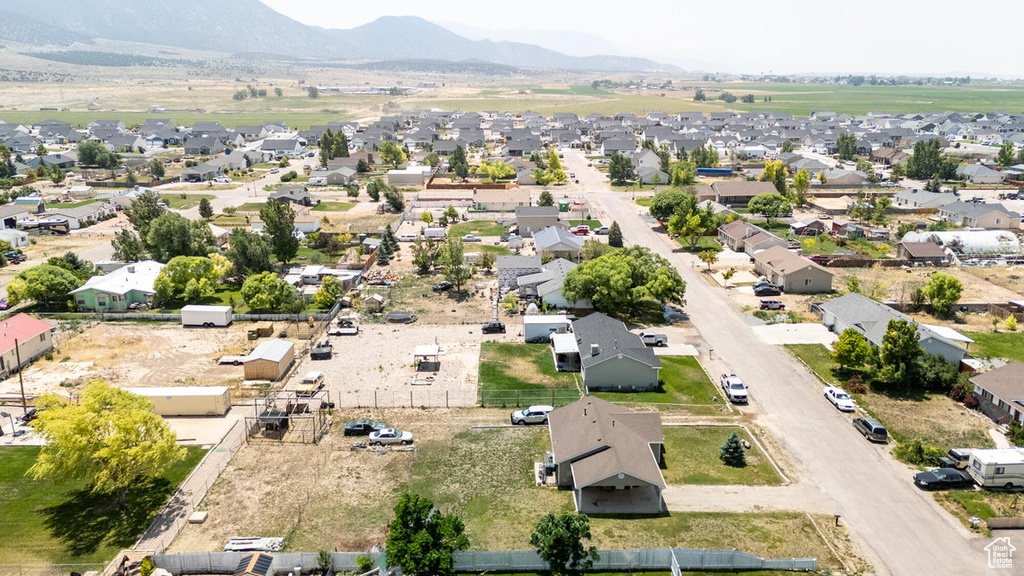 Aerial view of residential area featuring mountains