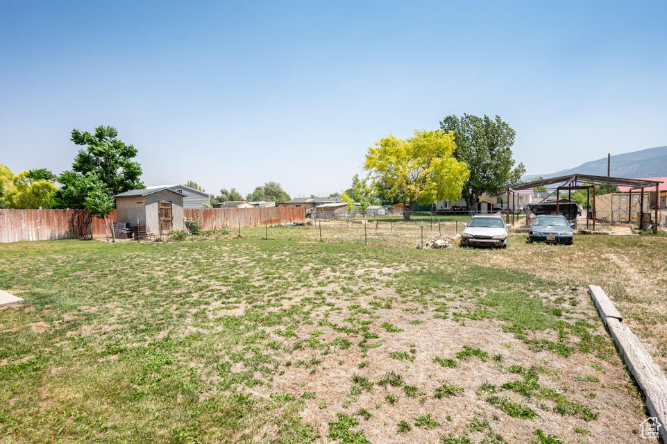 View of yard featuring a storage unit