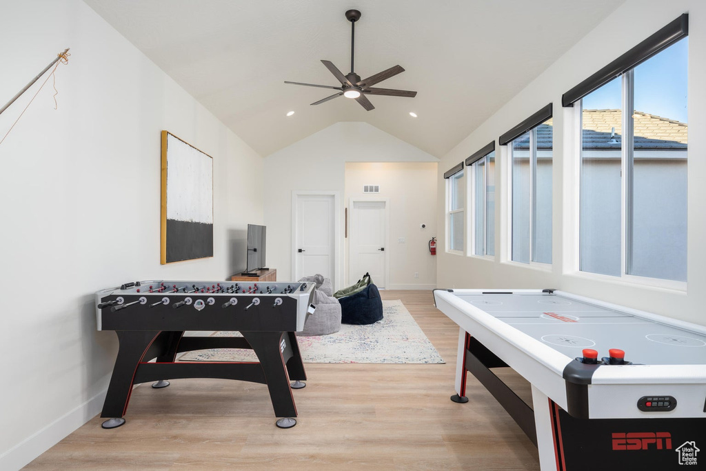 Game room featuring a ceiling fan, vaulted ceiling, light wood finished floors, and recessed lighting