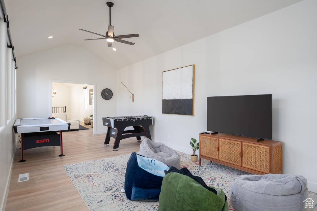 Rec room featuring a ceiling fan, wood finished floors, vaulted ceiling, and recessed lighting