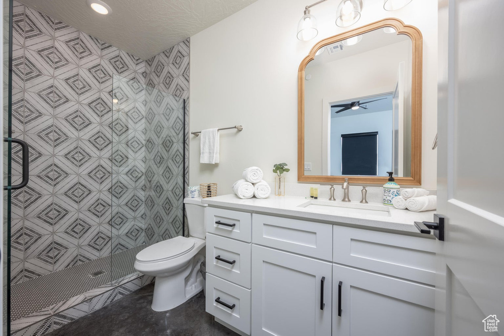 Bathroom featuring vanity and a stall shower