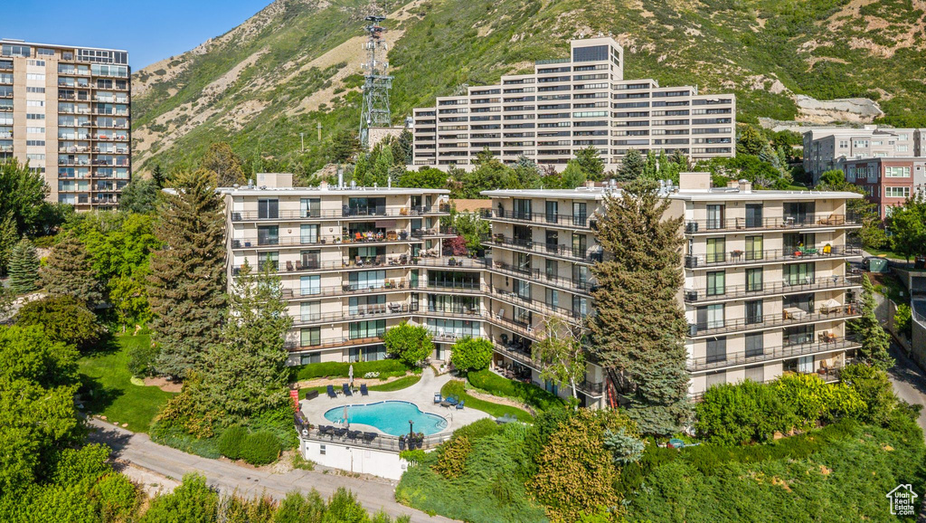 View of apartment building / complex featuring a mountain view