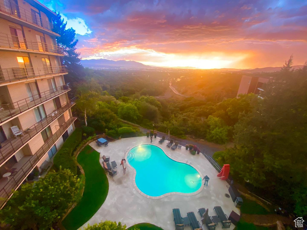 Community pool featuring a patio