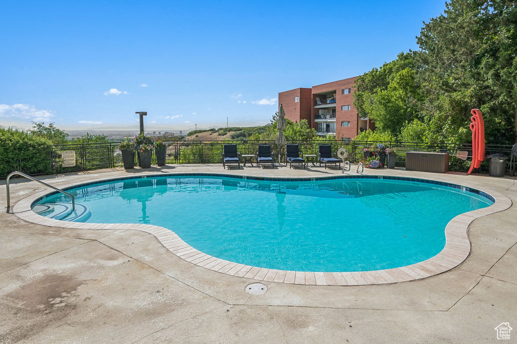Community pool with a patio area