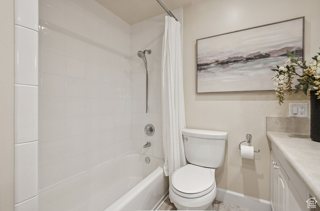 Full bathroom with shower / bath combo and vanity