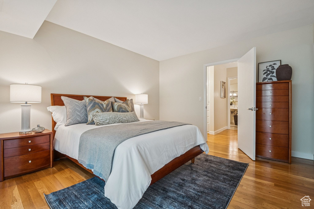 Bedroom featuring light wood-style flooring and baseboards