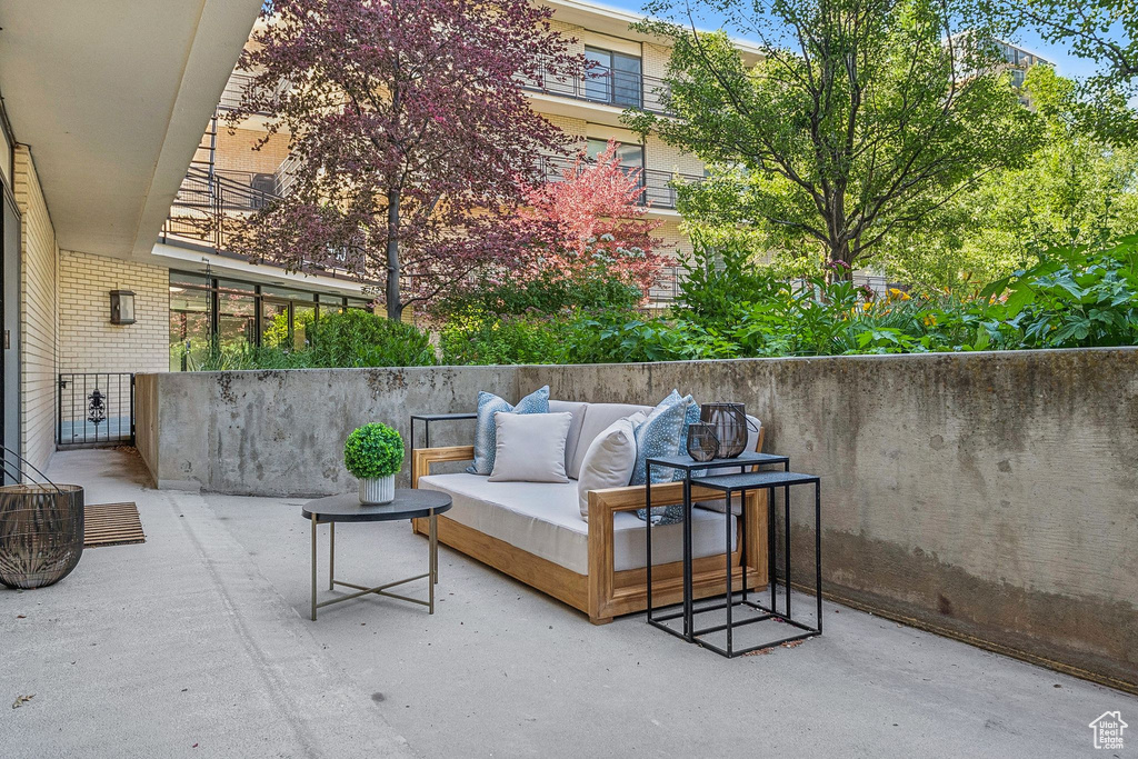 View of patio with an outdoor hangout area