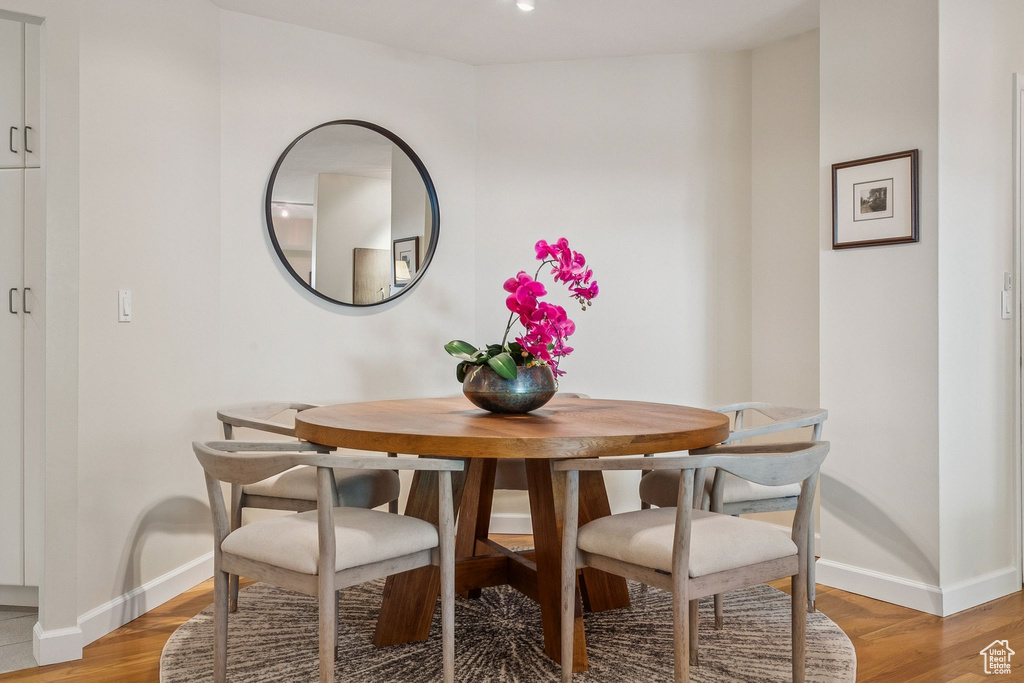 Dining room featuring baseboards and light wood finished floors