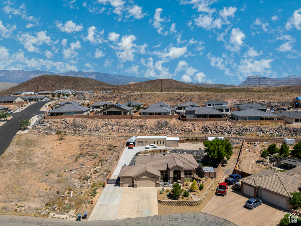Aerial view of residential area featuring a mountainous background