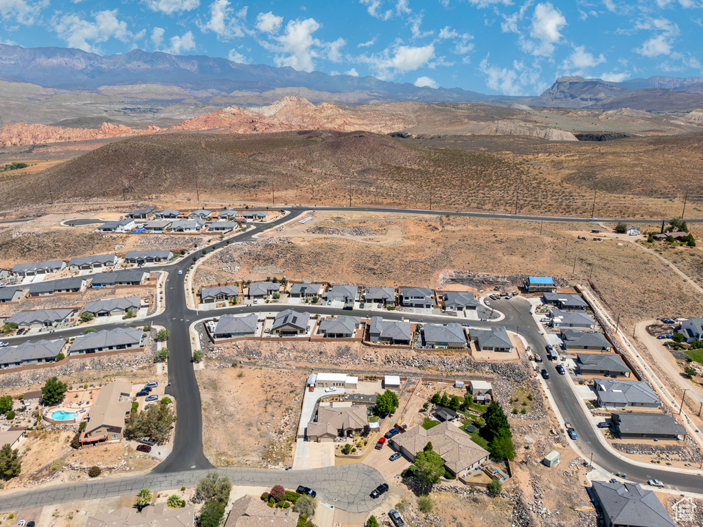 View of property location featuring a mountainous background and nearby suburban area