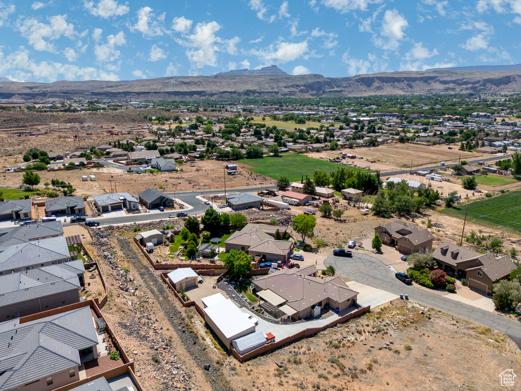 Aerial perspective of suburban area with a mountainous background