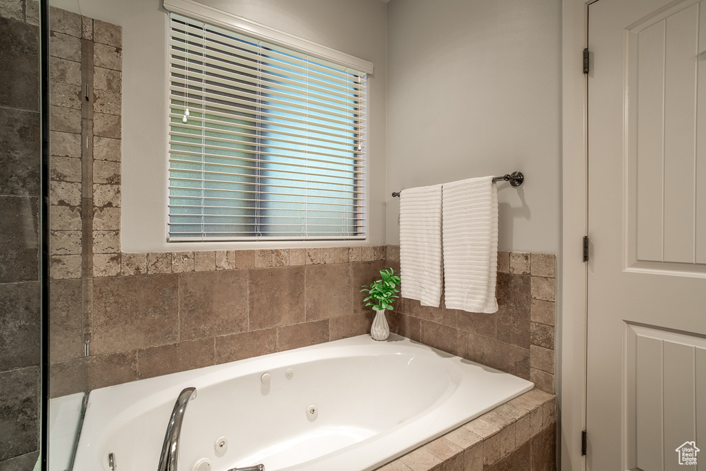 Bathroom featuring a tub with jets