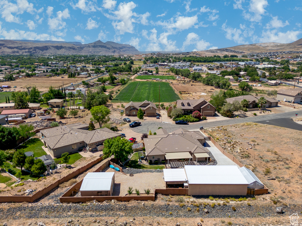 View from above of property with a mountain backdrop
