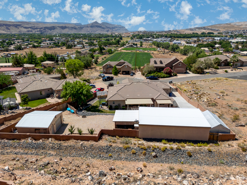 Aerial view of residential area featuring mountains