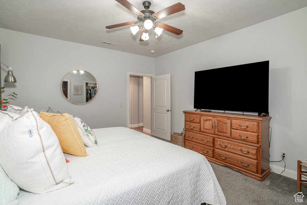 Bedroom with carpet and ceiling fan