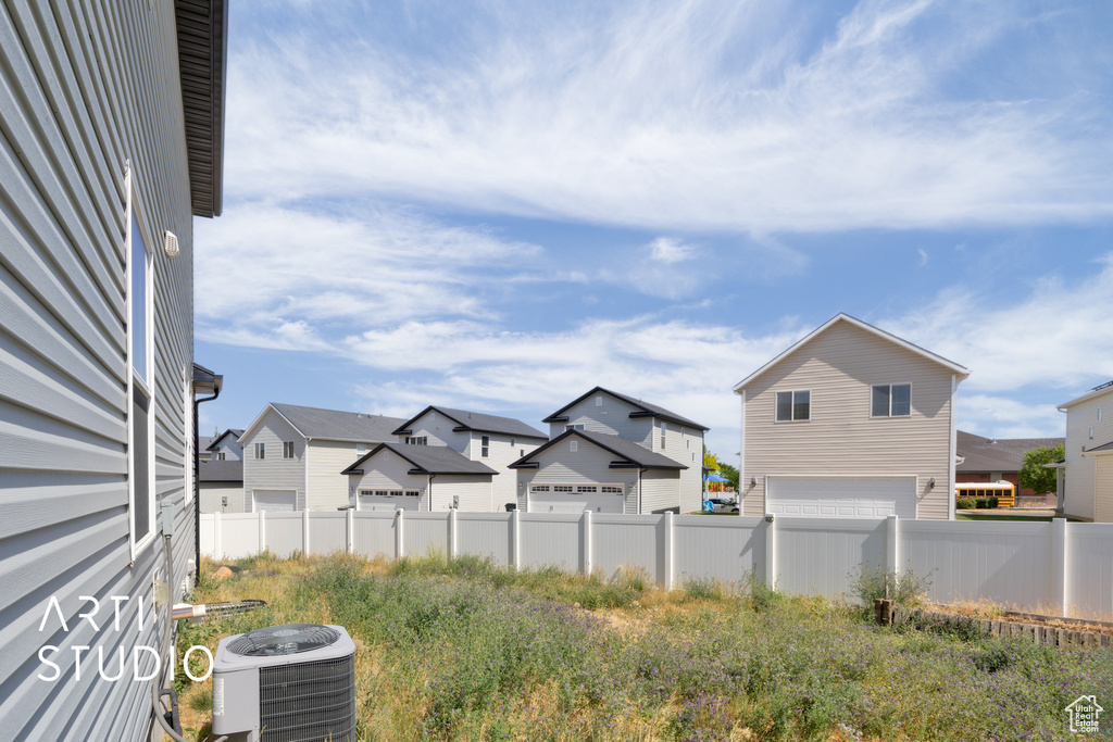 View of yard featuring a residential view and a garage