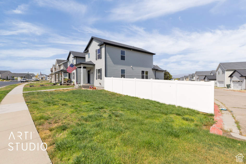 View of side of property featuring a residential view
