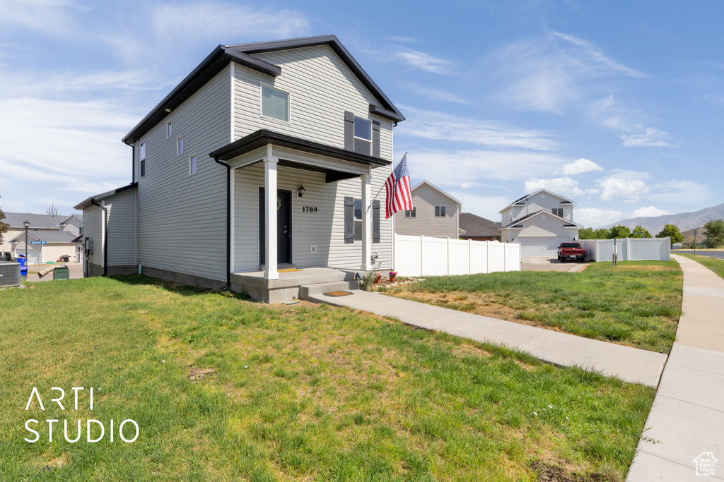 View of front of home featuring a mountain view